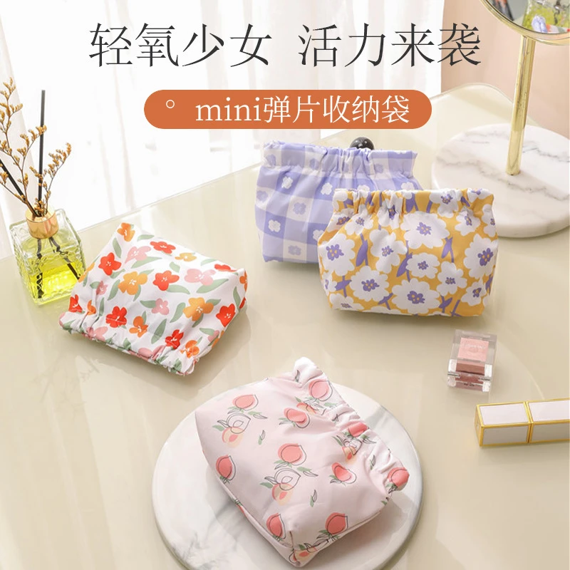 零钱可爱化妆包防水弹片印花收纳包随身携带口红迷你大容量化妆袋