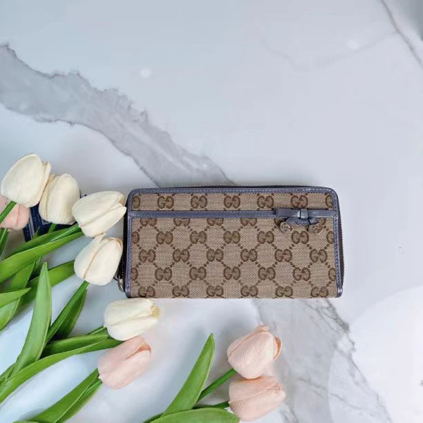 95新 GUCCI/古驰 时尚紫色帆布手拿钱包