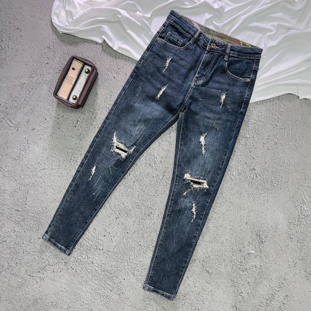 深蓝色牛仔裤男款2025秋冬新款韩版潮流九分破洞贴布修身小脚长裤