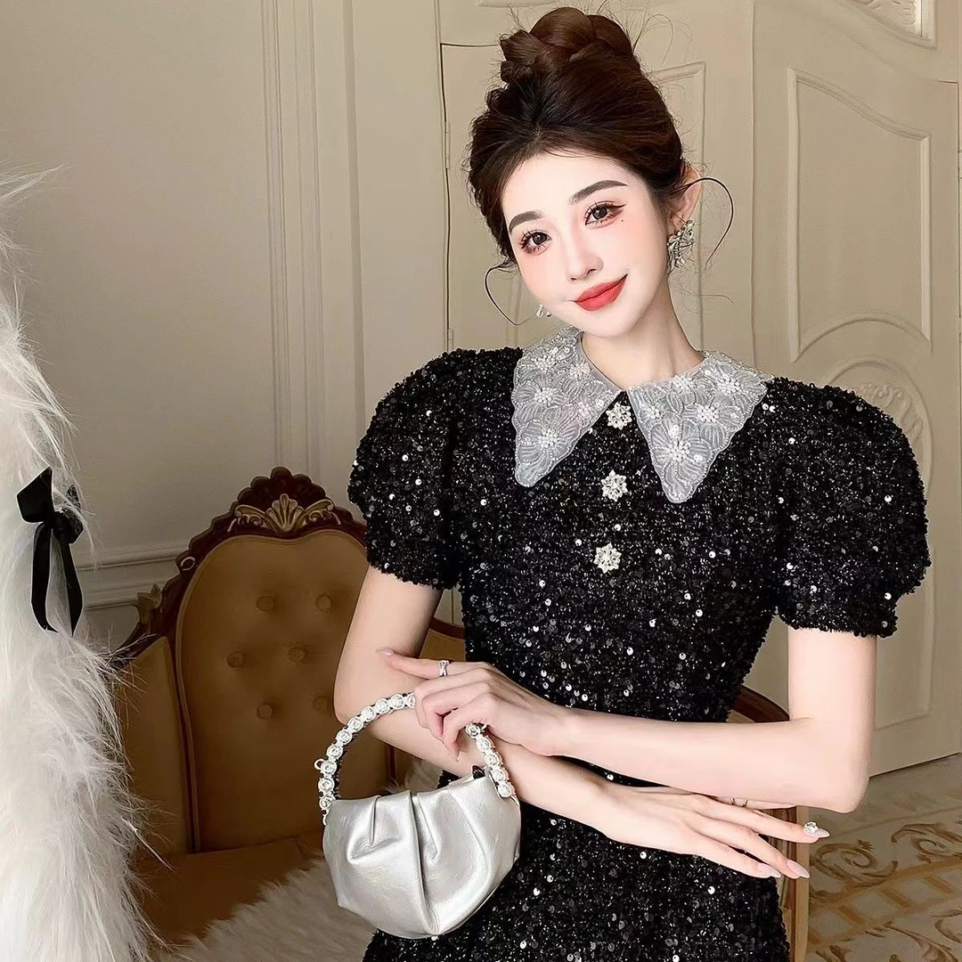 赫本风黑色重工高定亮丝料手工钉钻翻领造型短袖烫钻收腰连衣裙子