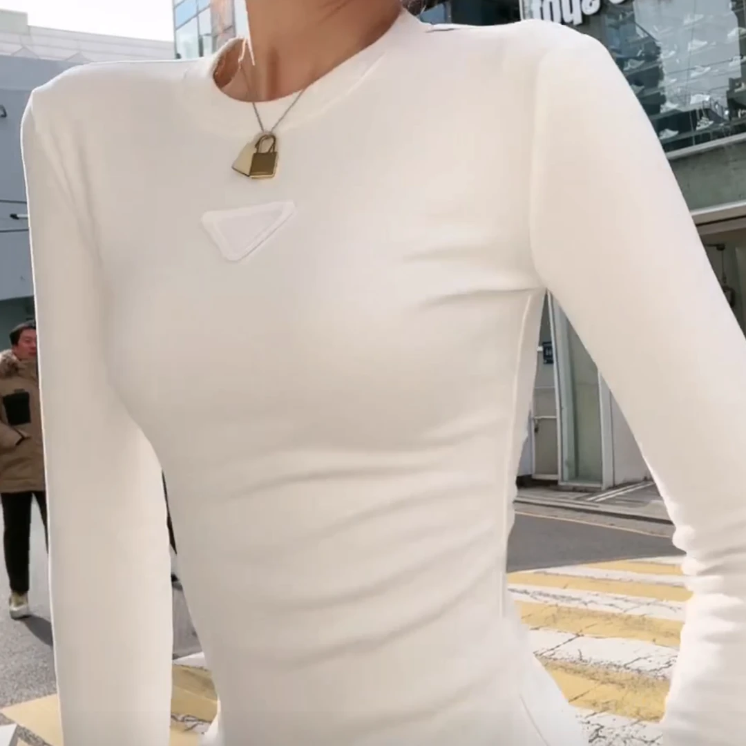 设计感三角标白色长袖T恤女冬季韩系修身百搭圆领纯色打底衫上衣