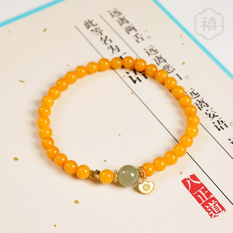 天然琥珀蜜蜡手串创意小元宝牌配饰时尚轻奢手链