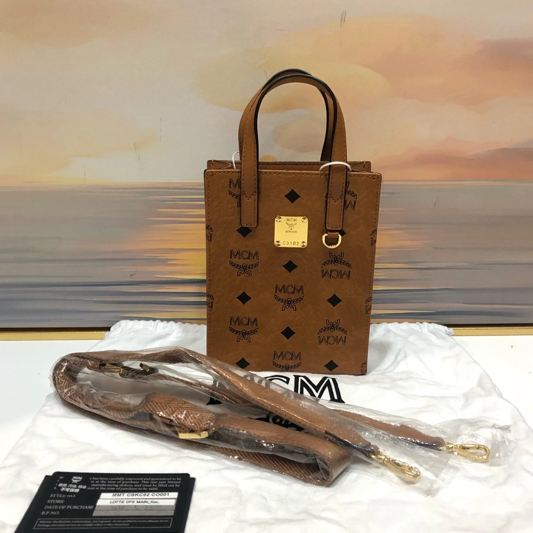 99新 MCM 【蔡包紫】98-99新干邑色琴谱手提包斜挎包