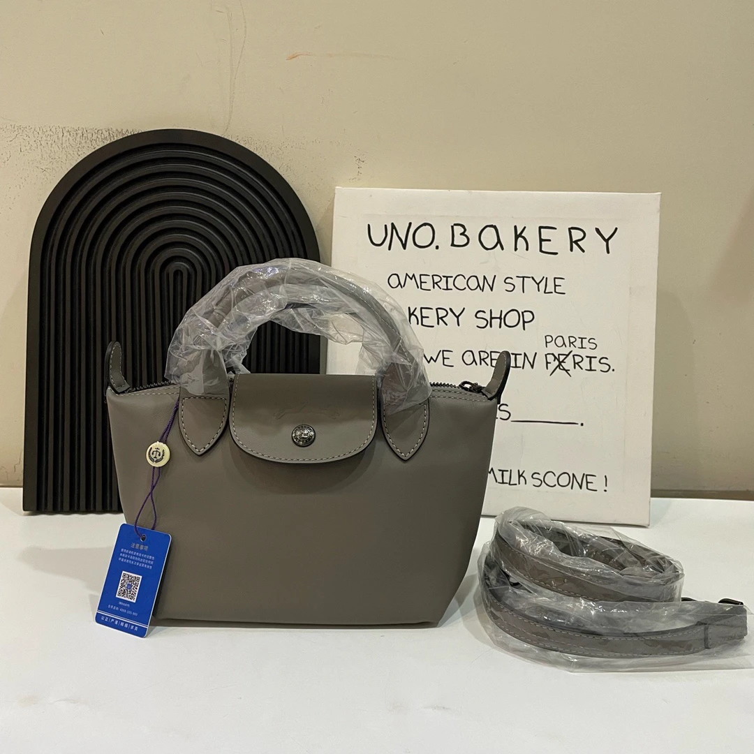 99新  【蔡包紫】Longchamp 珑骧牛皮 斜挎手拿包