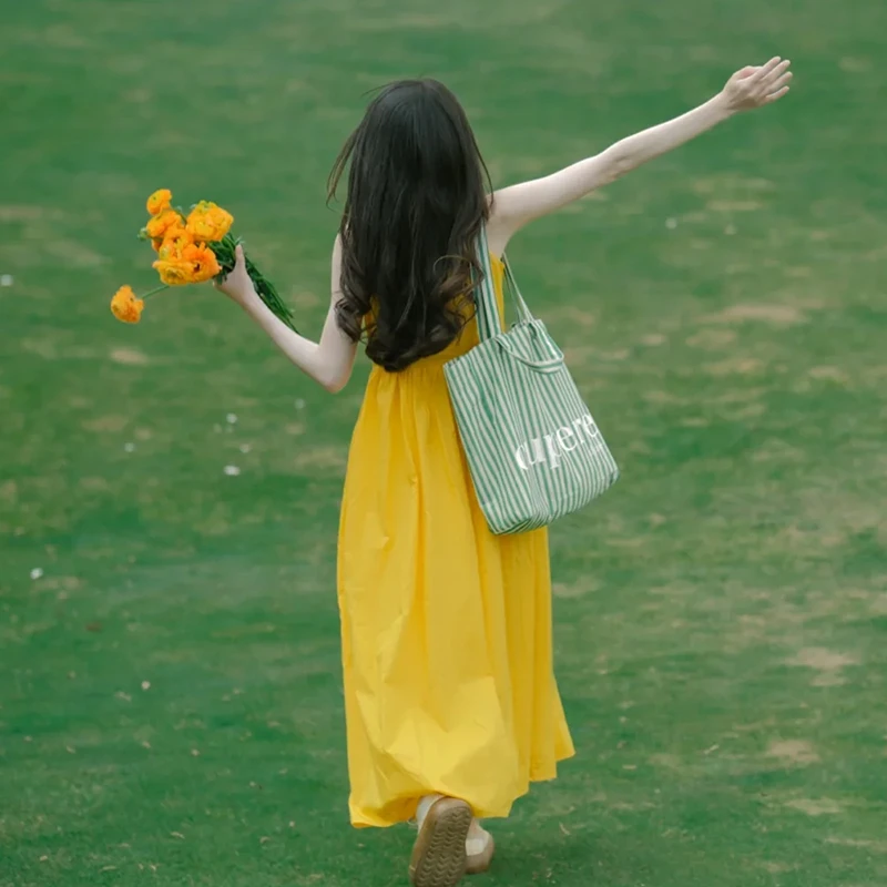4285黄色吊带连衣裙子女2025春季法式温柔风温婉大方穿搭裙