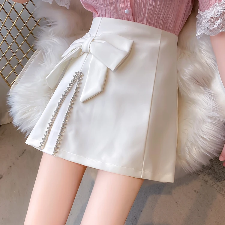 春夏秋2024新款设计感蝴蝶结包臀短裙高腰显瘦镶钻开叉a字半身裙