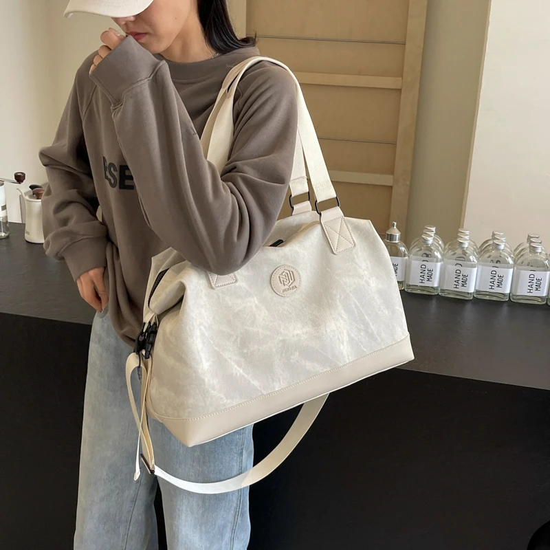 男女通用大容量短途旅行包女新款外出行李包男出差旅游收纳登机包