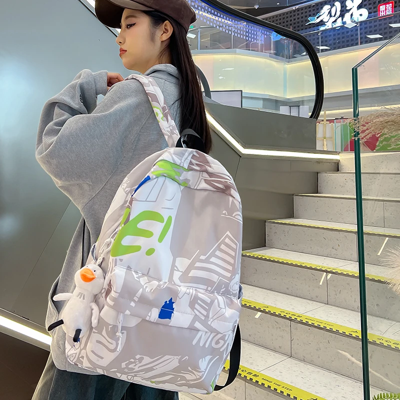 涂鸦印花双肩包女大学生2024新款韩版潮流休闲背包男高中书包