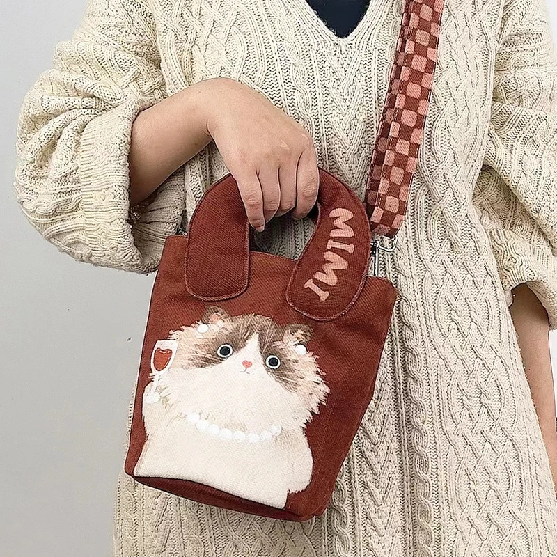 弘娜×一点心意 原创复古秋冬猫咪手提单肩水桶包印花斜挎女休闲包