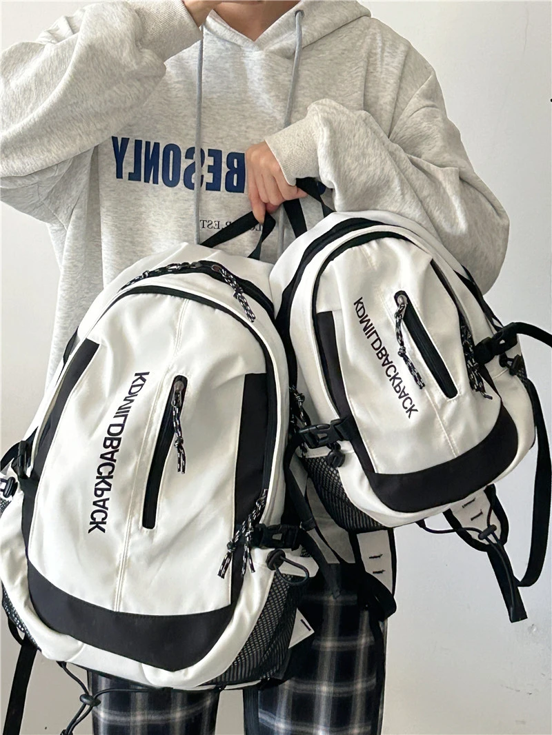 大容量学生休闲百搭双肩包女男中性简约减负书包高中旅行电脑背包