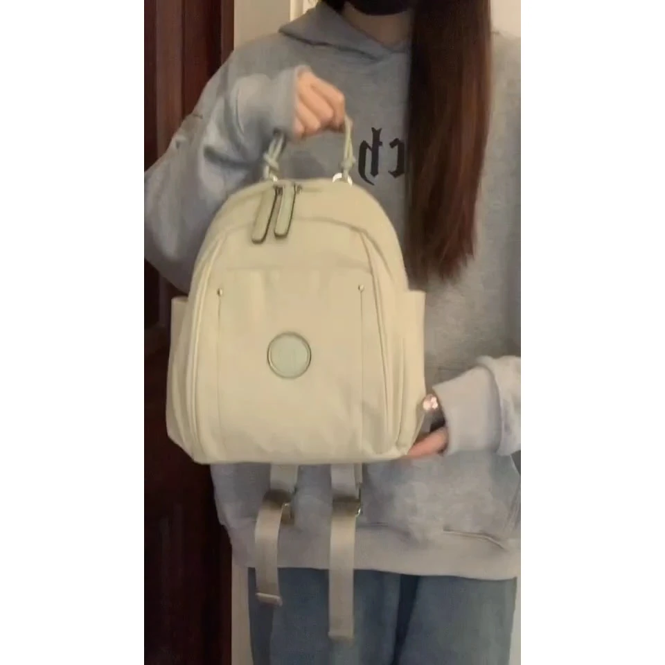 通勤轻便简约帆布双肩背包女士2024春夏新款大容量百搭单肩手提包