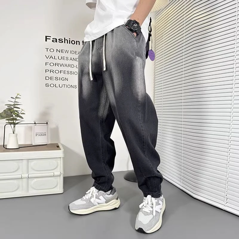 潮牌青年百搭个性水洗牛仔裤男宽松小直脚哈伦裤秋冬款休闲裤子男