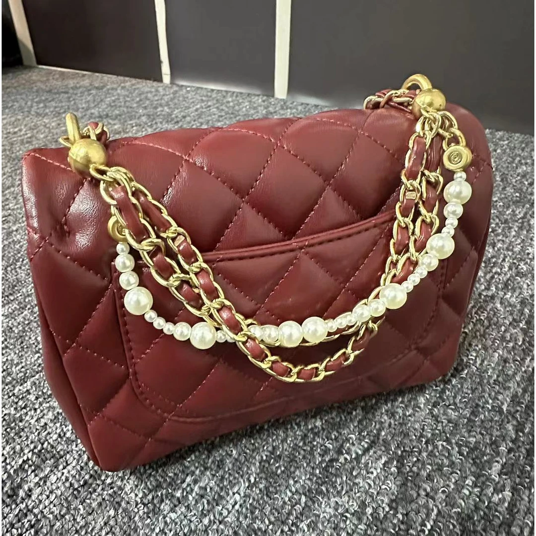 姝宴真皮女包珍珠胖红色