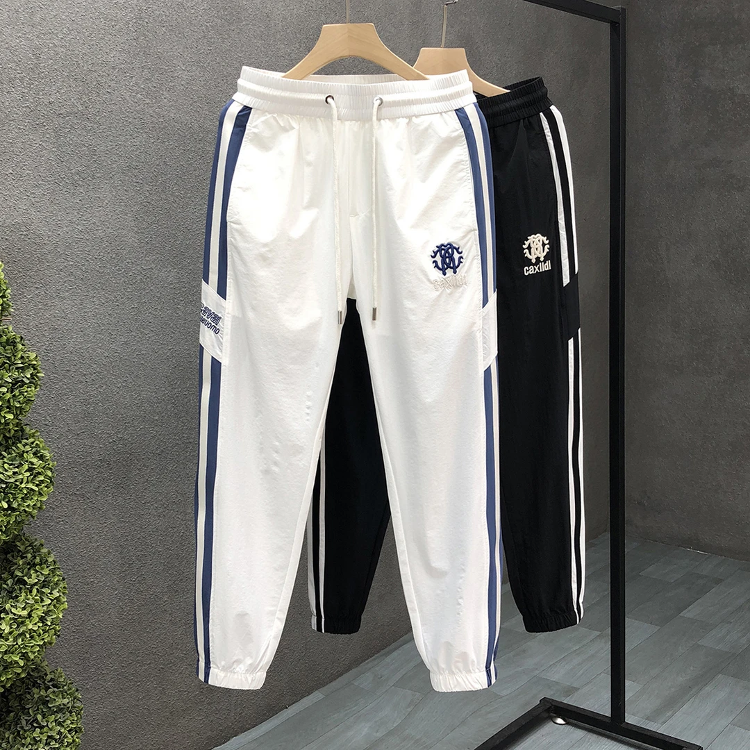 高端轻奢白色裤子男潮牌束脚运动休闲裤2025夏季新款男士薄款长裤