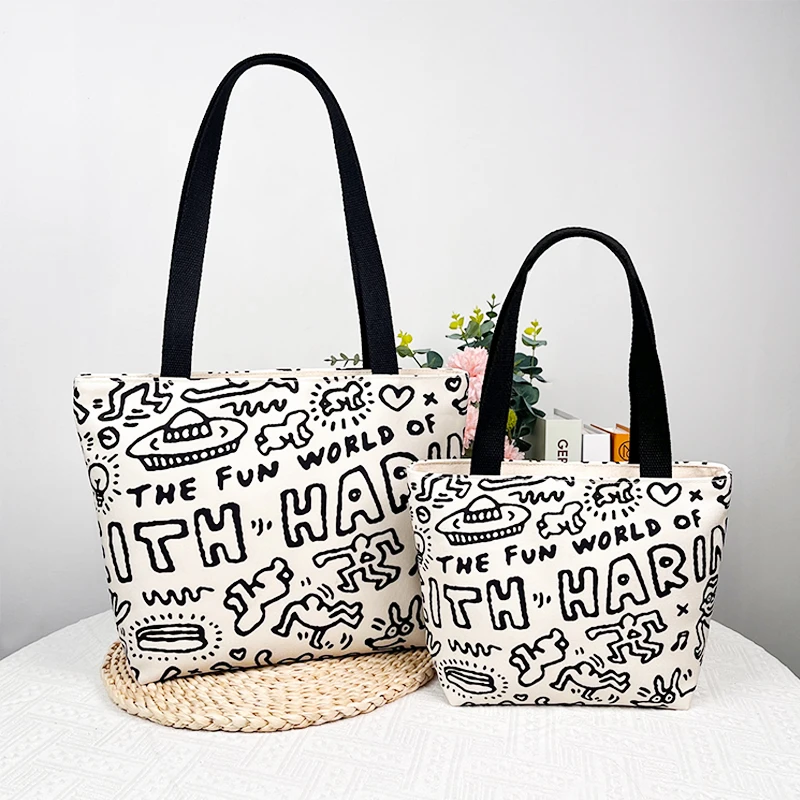 2023新款时尚学生手提包网红帆布英文涂鸦包包大容量单肩饭盒包女
