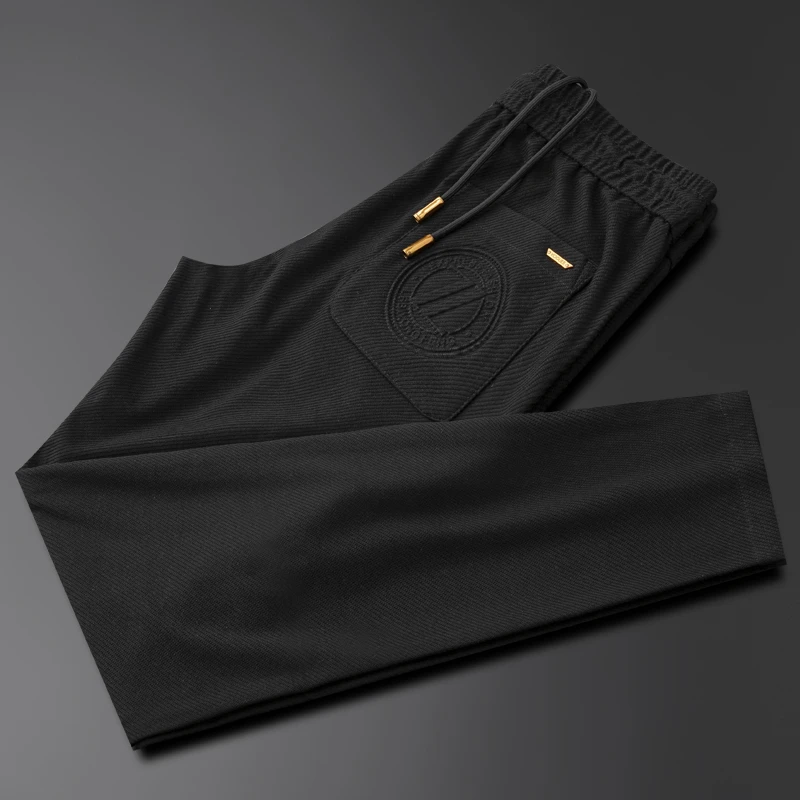 高端欧货男士春夏季新款休闲运动裤时尚修身弹力小脚裤黑色男卫裤