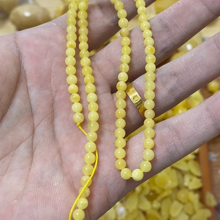 蜜蜡裸石未镶嵌含**脉串