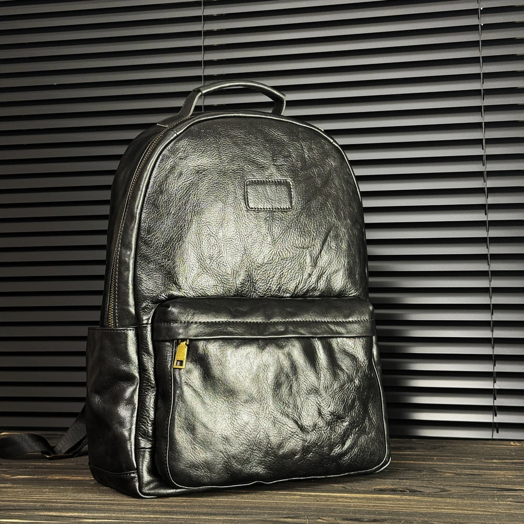 硬野手抓纹真皮双肩包