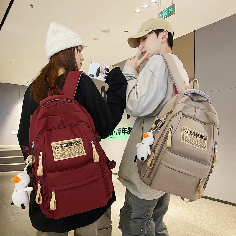 韩版休闲学院风双肩包女时尚潮流中学生书包大学生情侣电脑双肩包