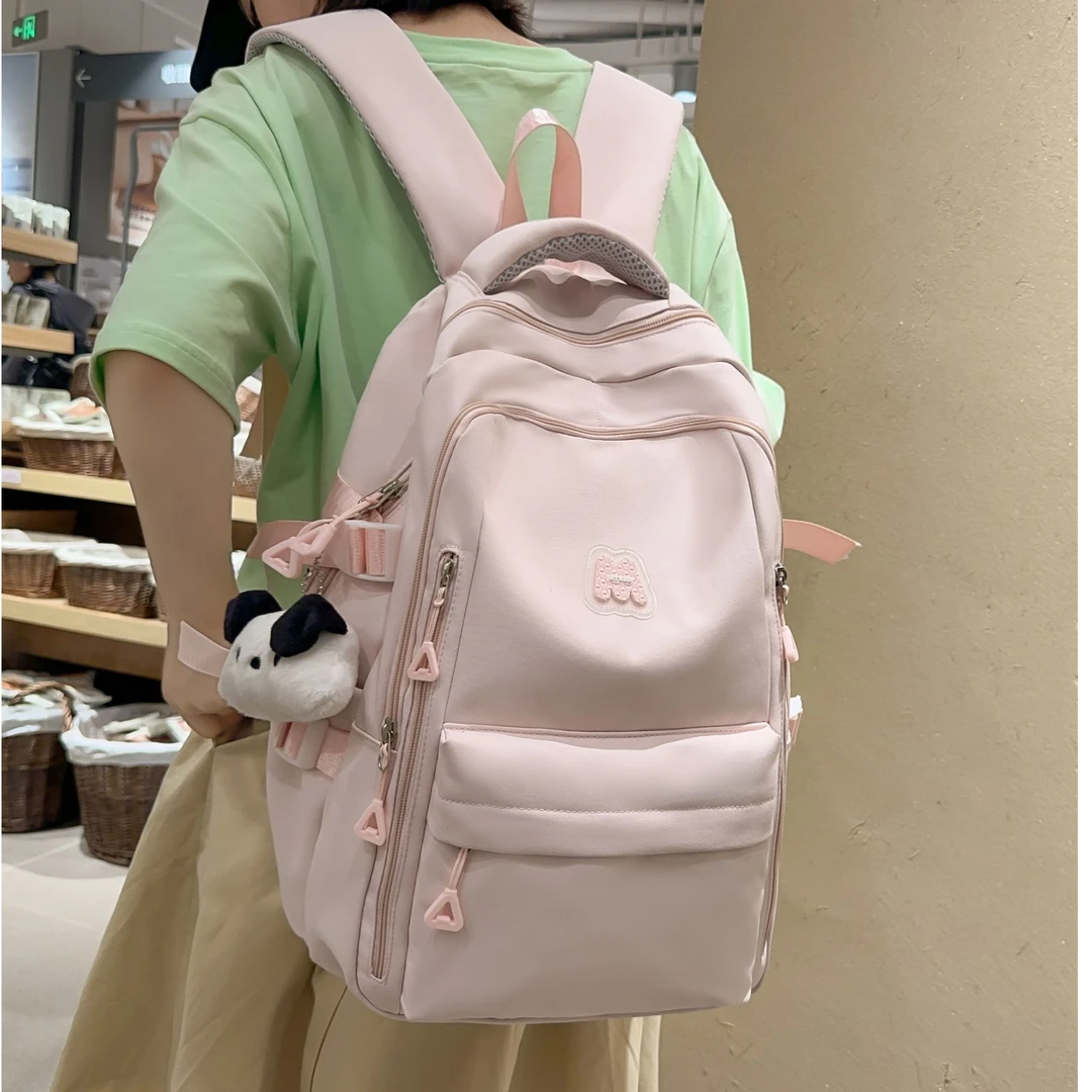 书包初中女生高颜值大容量纯色减负背包高中生小学生简约双肩包女