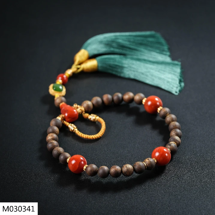 【老掌柜讲珠宝】南红沉香圆珠手持 M030341