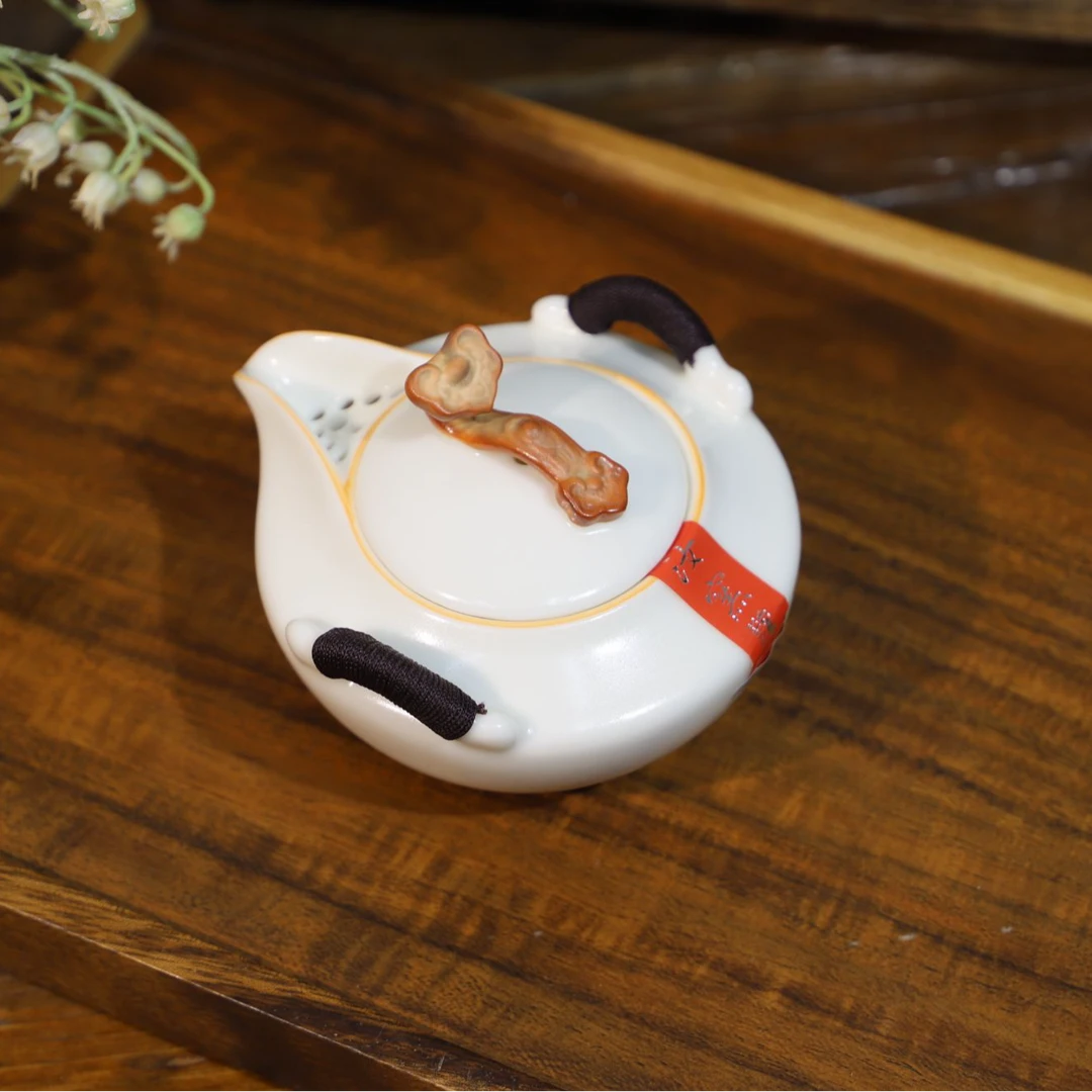 元本道象牙白如意手抓壶