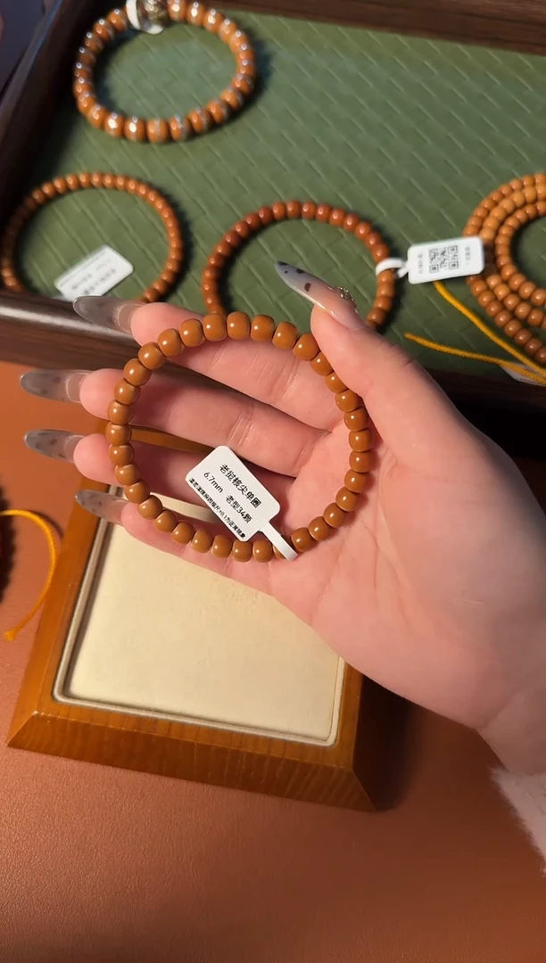 手串橄榄核6.7mm老挝核尖老型单圈、正三花