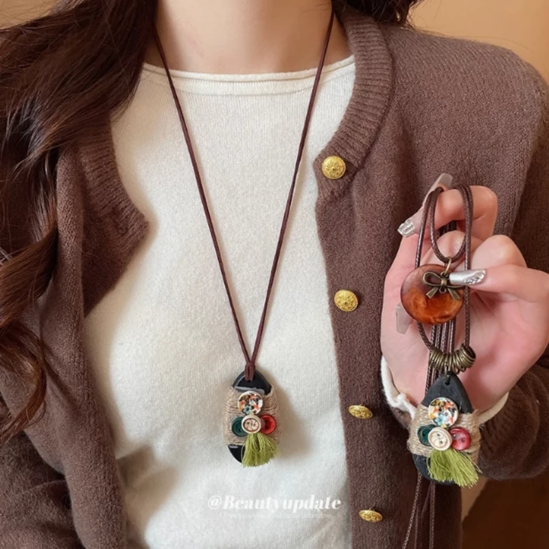 钛钢项链 民族风蝴蝶结纽扣吊坠项链女异域风毛衣链高级时尚饰品