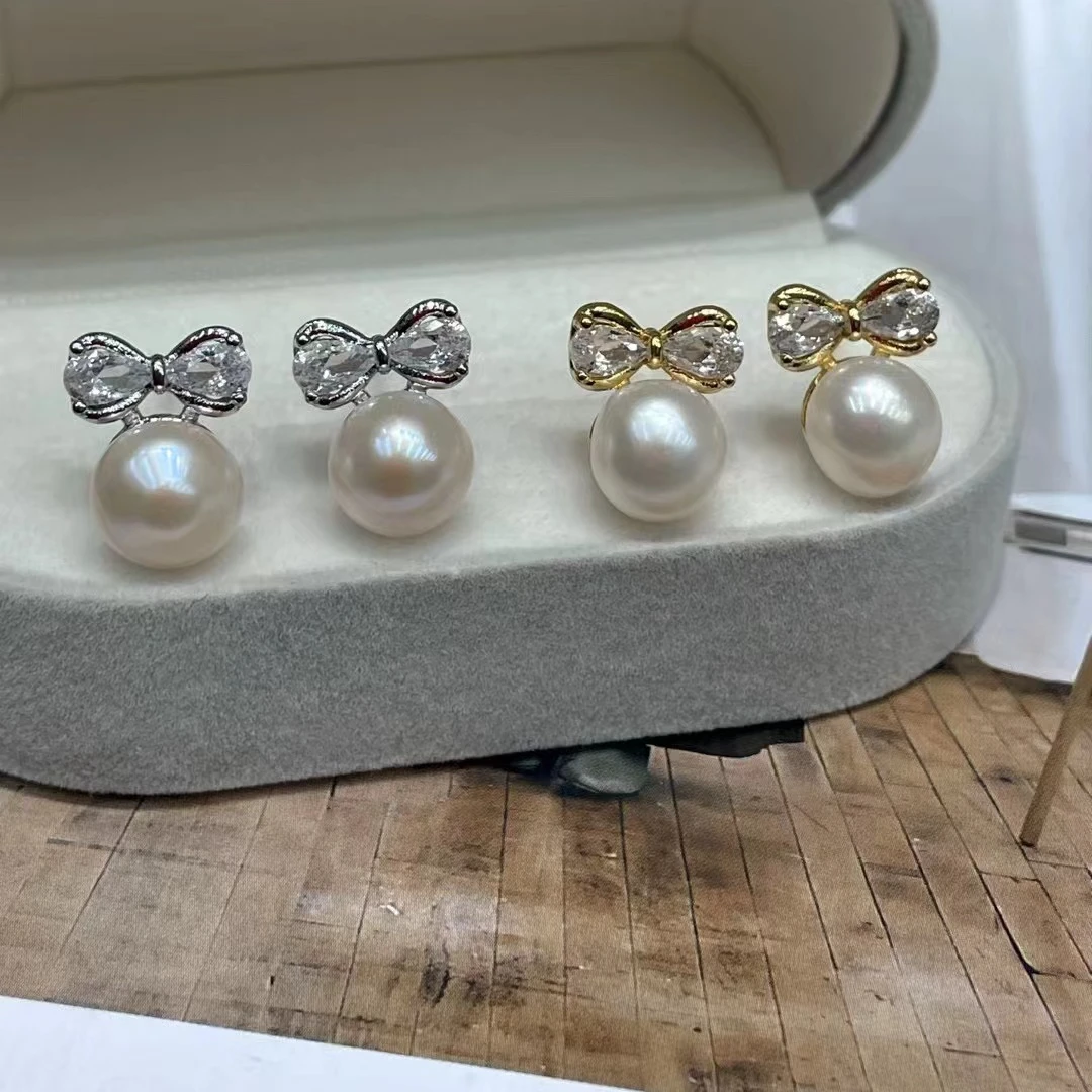 蝴蝶结珍珠耳钉。两色可以选气质白色轻奢时尚百搭简约经典精致