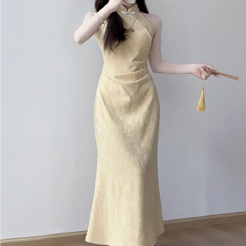 淡黄色的连衣裙长裙中考旗袍新款夏季女流行高端修身挂脖袍新中式