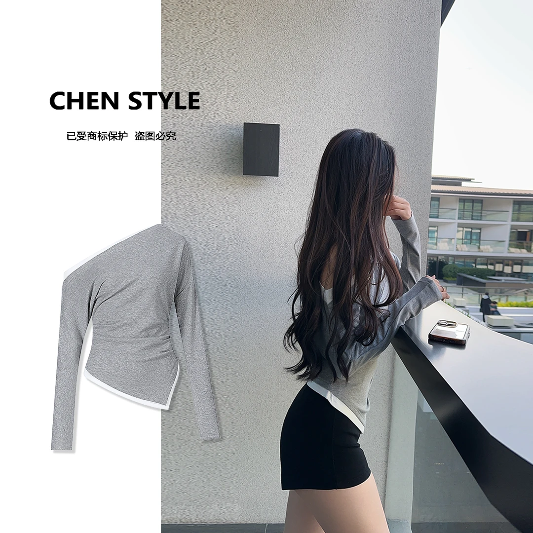 王炸炸~【女团身姿】Y22357春款不规则收腰显瘦斜肩拼色上衣