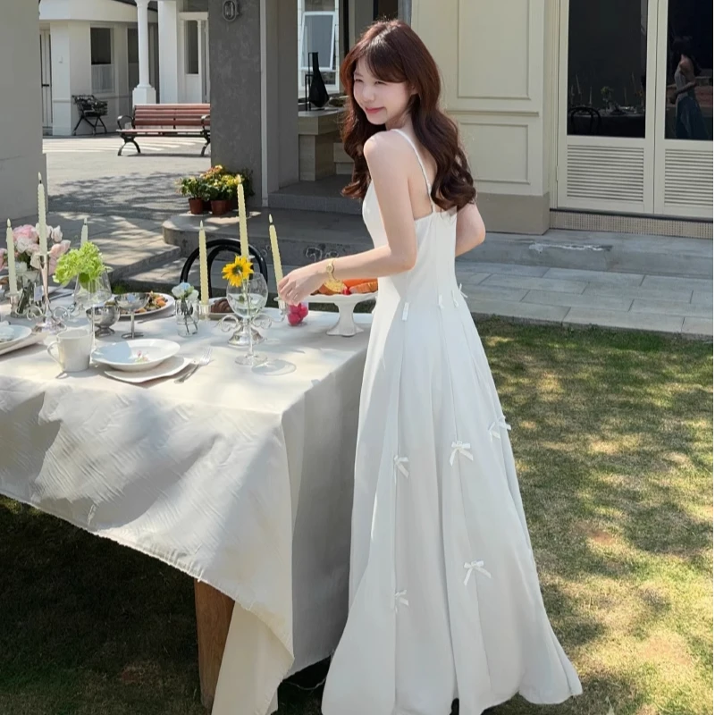 蝴蝶结气质显瘦吊带连衣裙女2025春季设计感两穿超仙收腰显瘦长裙