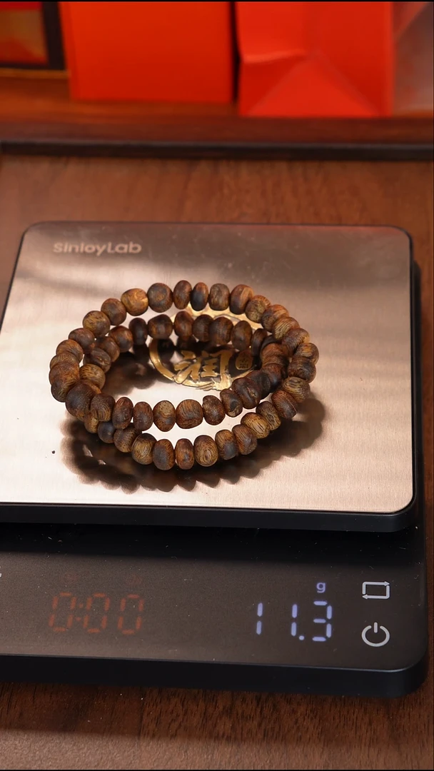 沉香手串咆****?海南莺歌绿奇楠虫漏随型双圈手串