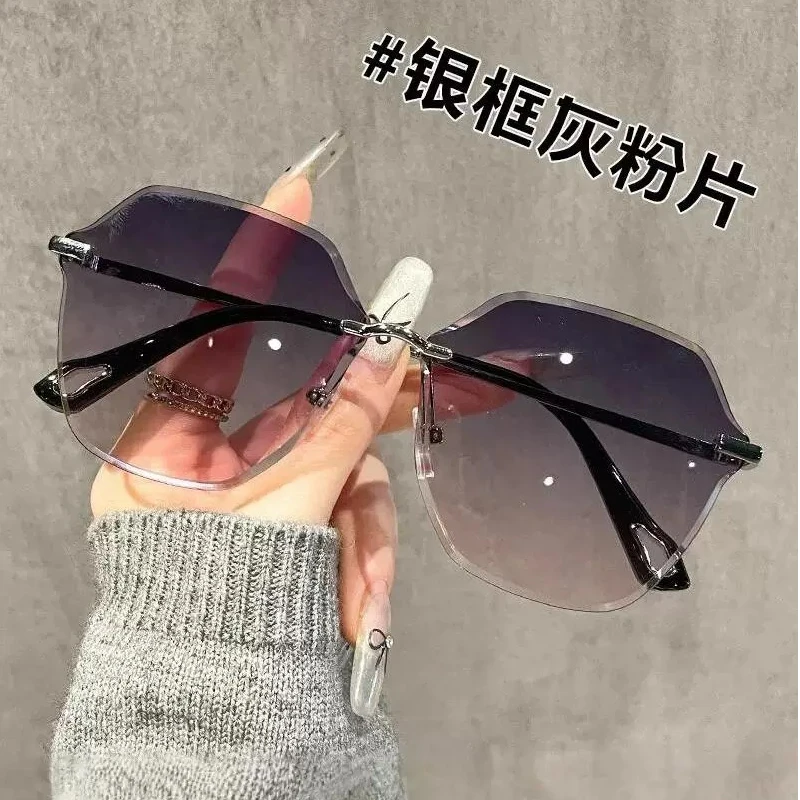 时尚气质女士太阳眼镜网红时尚百搭防紫外线无框渐变灰粉墨镜女潮