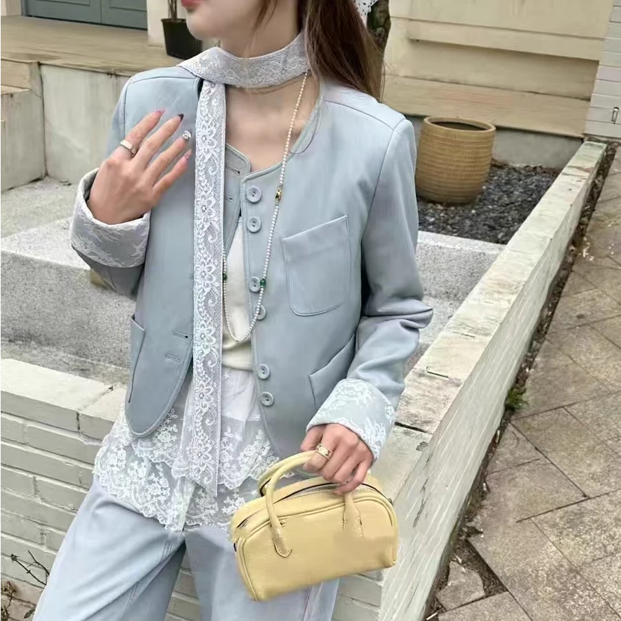 252202蕾丝飘带新款圆领设计感短款皮衣小外套简约气质女装上衣