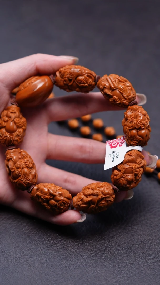 把件橄榄核骑兽双童子财神·