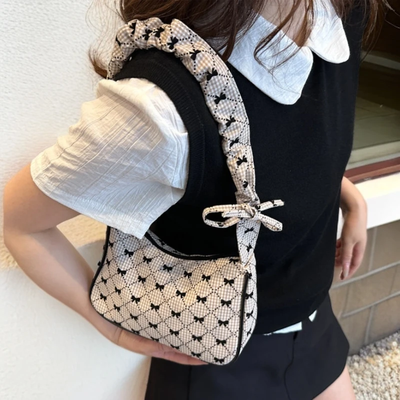 单肩斜挎包简约时尚布袋包包女2025通勤新款休闲百搭蝴蝶结腋下包