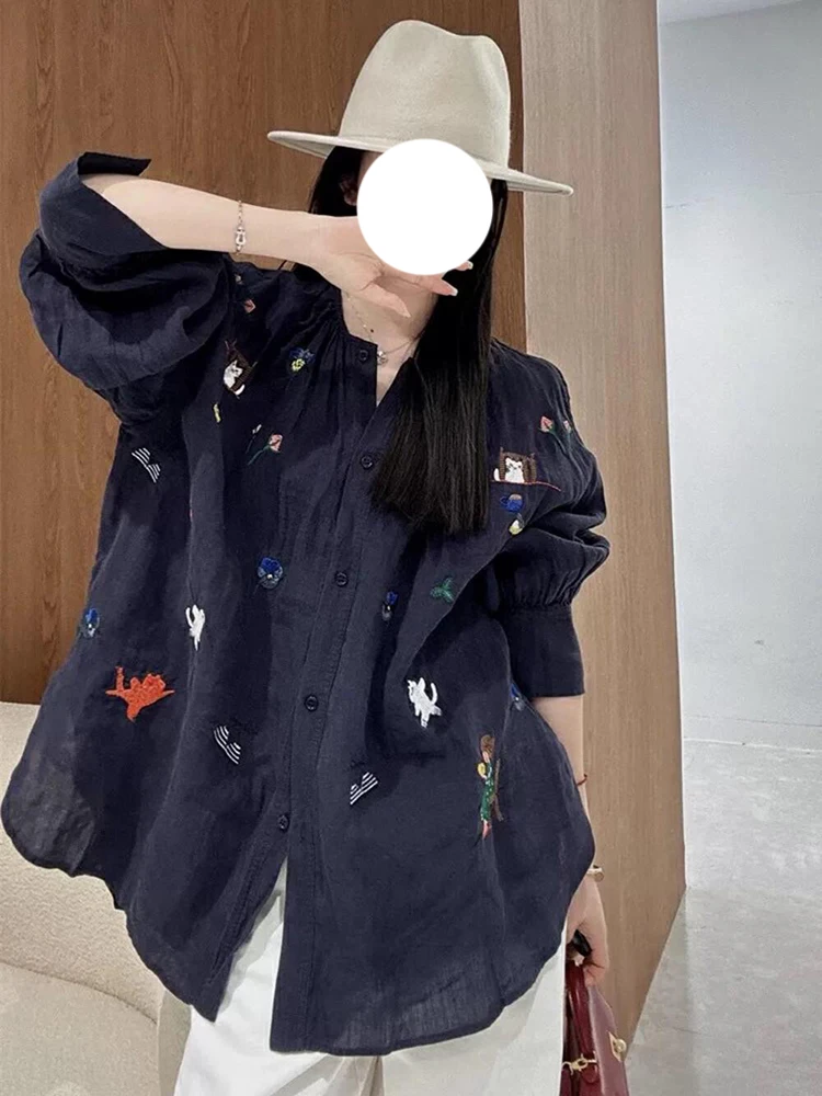 2025年超火春装独特绝美上衣高级感轻奢洋气减龄藏蓝色印花衬衫女