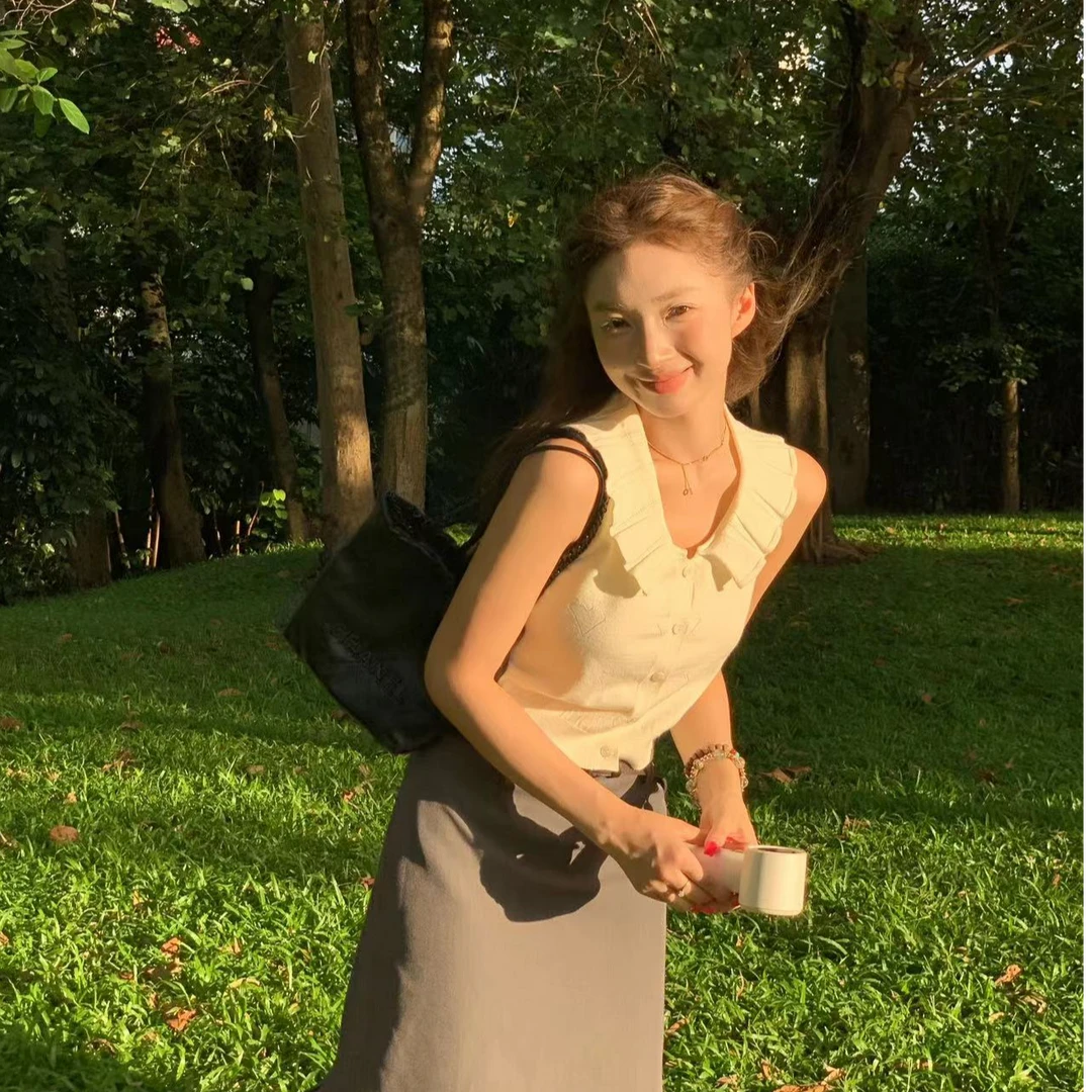 清清款70不是七十【白糖奶昔】夏秋韩版毛织荷叶领镂空无袖小衫上衣