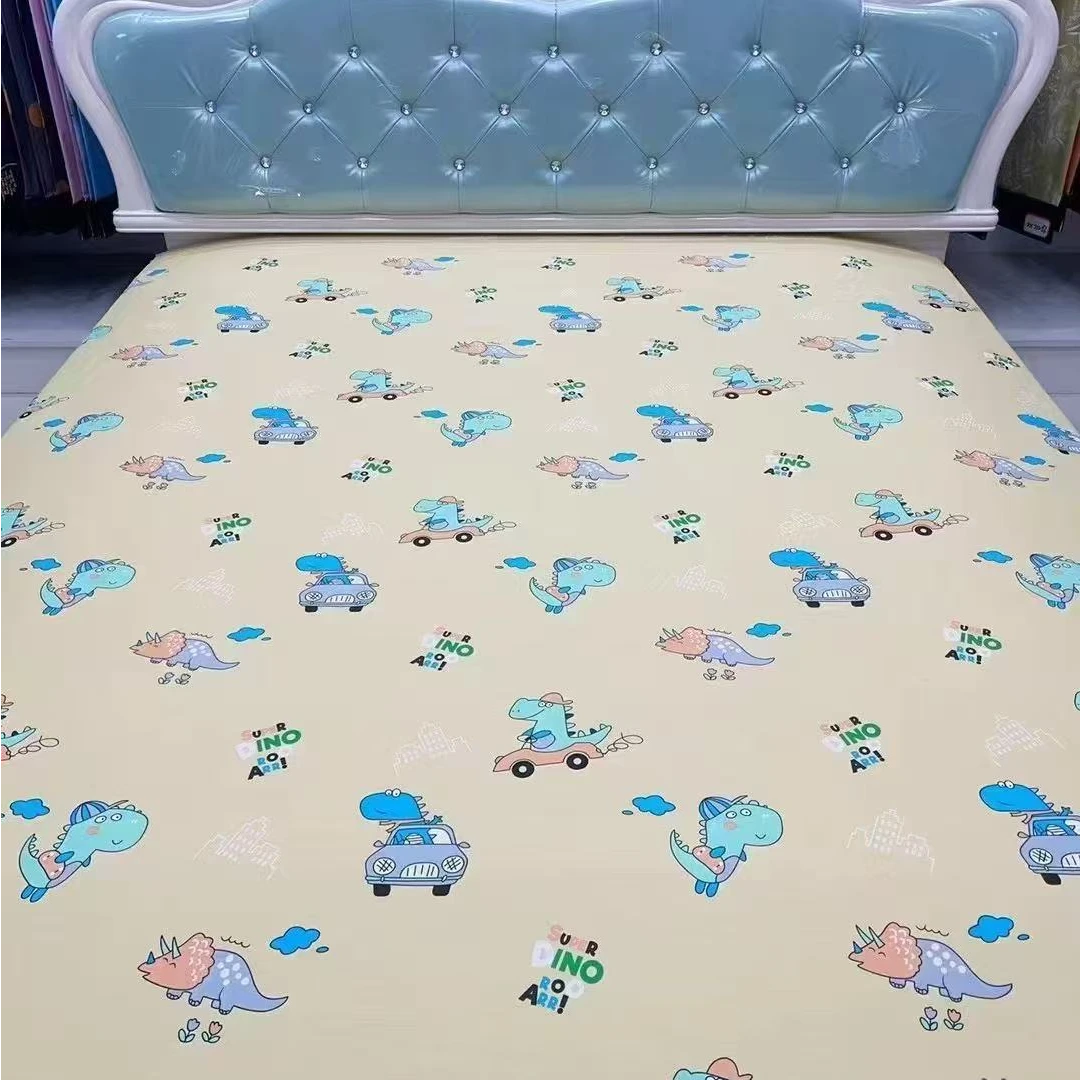 《纯棉斜纹棉》恐龙宝宝黄高支斜纹全棉面料布料批发