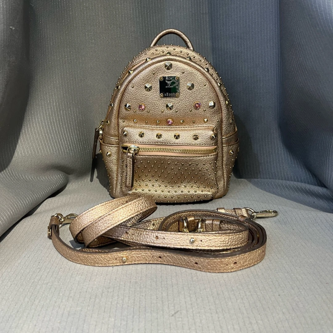 95新 MCM MCM香槟色铆钉mini双肩包