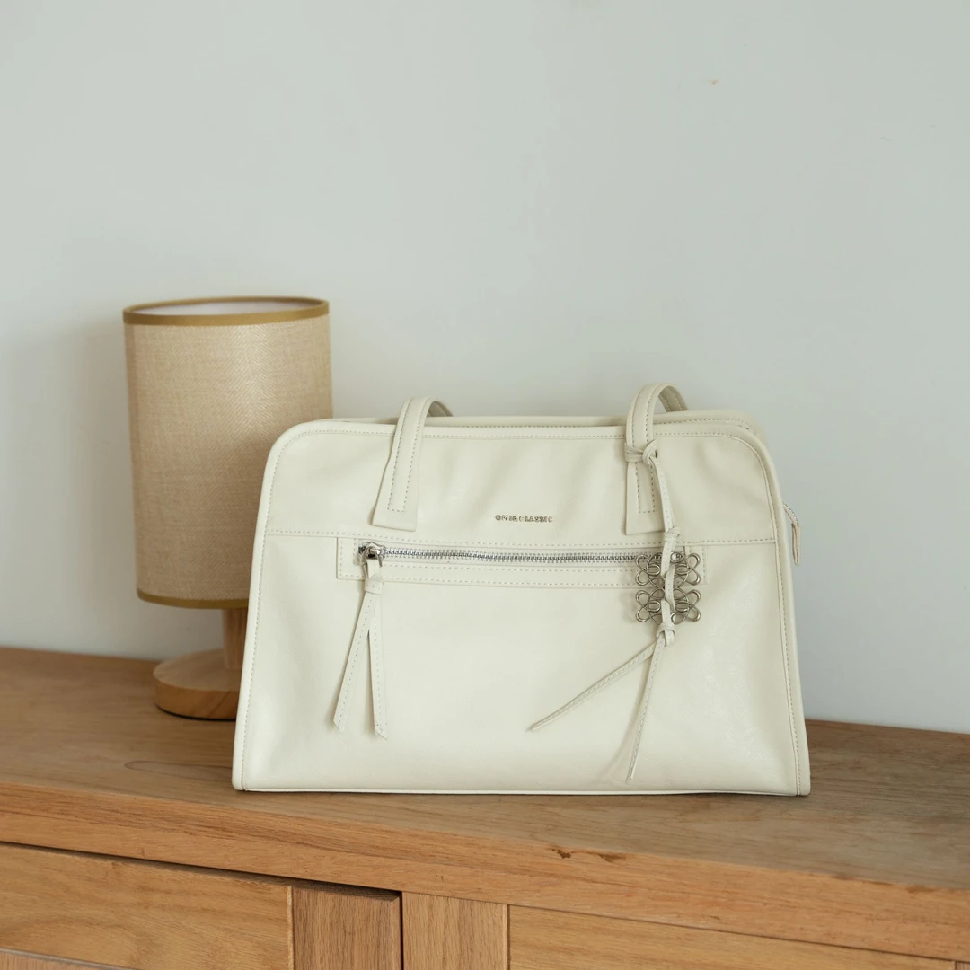 OMI学院风简约通勤时尚百搭牛皮大容量新品上新