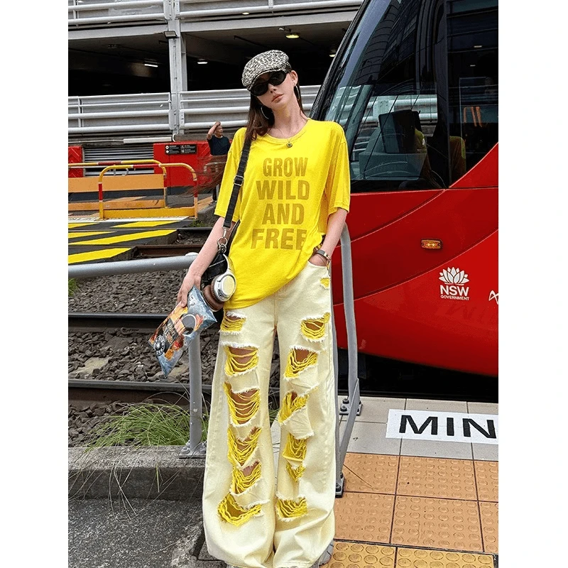 黄色破洞牛仔裤女夏季ootd设计感不规则小众辣妹宽松阔腿女装长裤
