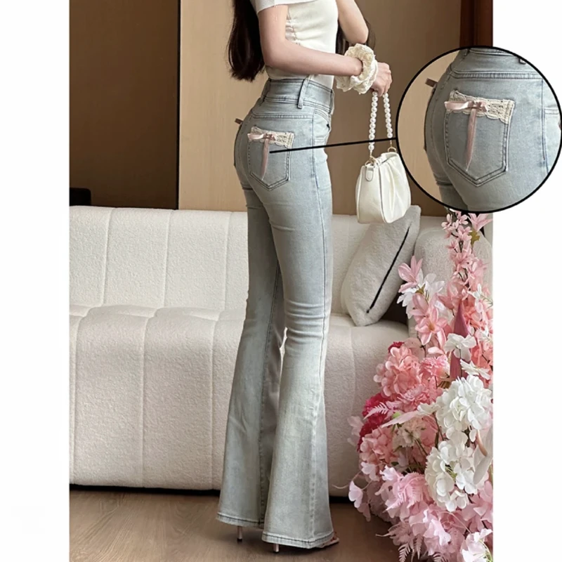 蝴蝶结蕾丝拼接微喇牛仔裤女2025春季新款提臀显瘦长裤蛮腰纪