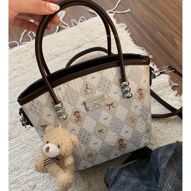 韩系可爱手提包包女款爆款2025新款早秋时尚水桶包百搭通勤斜挎包