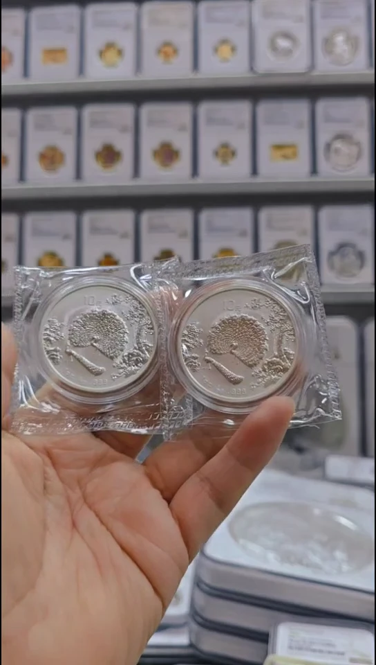 纯银鹿*1997年孔雀银币差品2枚有证无盒