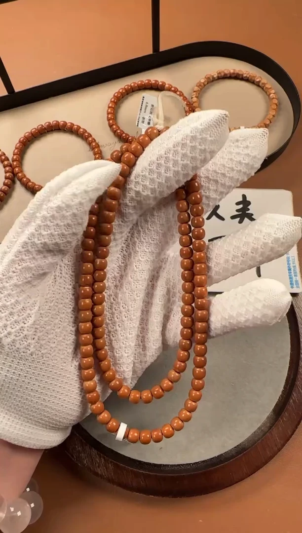 手串橄榄核6.6mm老型珠老挝料108，孔道微三花白