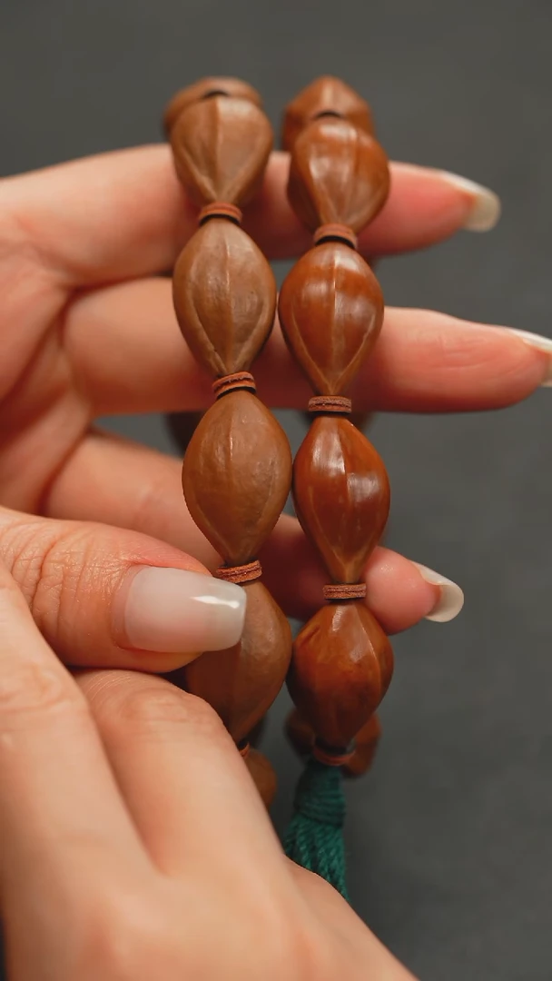 橄榄核手串三花三面佛素串