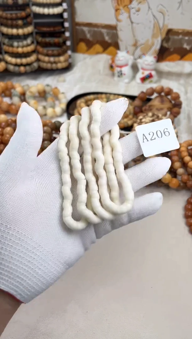 菩提根/象牙果手串a206卡0.66 白玉机抛