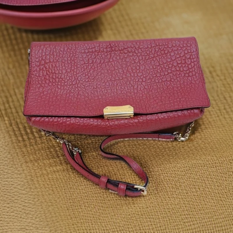 95新 BURBERRY/博柏利  紫红色压纹斜挎包 1478 2675